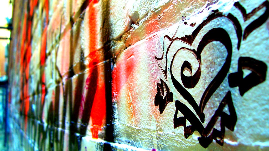 Graffiti image of a heart in black paint, same style of graffiti found in downtown Toronto